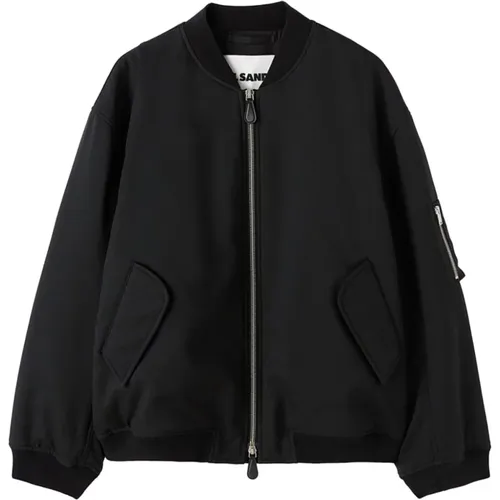Coats,Schwarzer Mantel aus recyceltem Polyester mit Rippbündchen - Jil Sander - Modalova