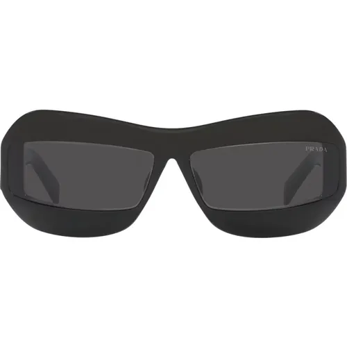 Sonnenbrille mit unregelmäßiger Form in Schwarz mit dunkelgrauen Gläsern , unisex, Größe: 68 MM - Prada - Modalova