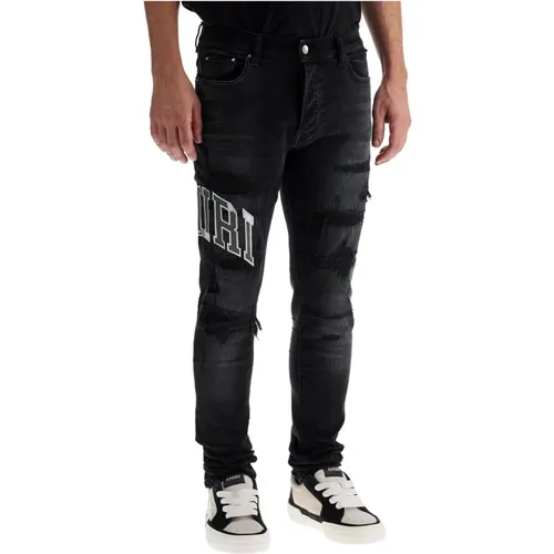 Distressed Skinny Jeans mit Varsity Logo - Amiri - Modalova