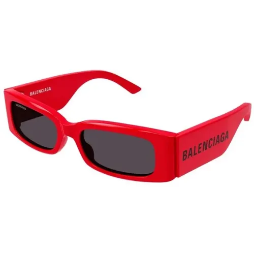 Sonnenbrille mit rotem Rahmen und grauen Gläsern - Balenciaga - Modalova