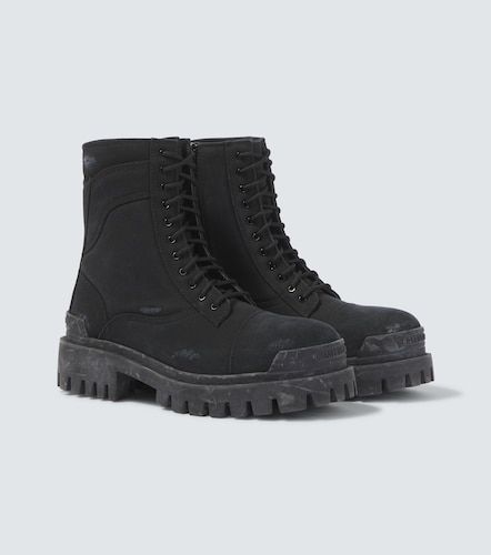 Botas Combat Strike de lona con cordones - Balenciaga - Modalova