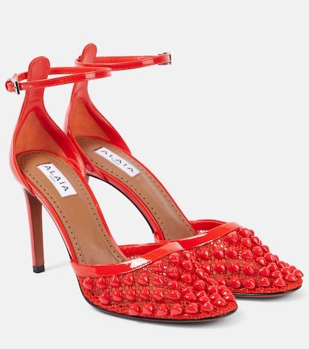 Studded mesh and leather pumps - Alaia - Modalova