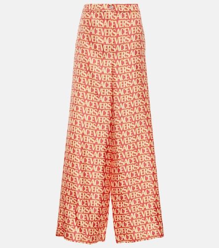 Pantaloni a gamba larga in seta - Versace - Modalova