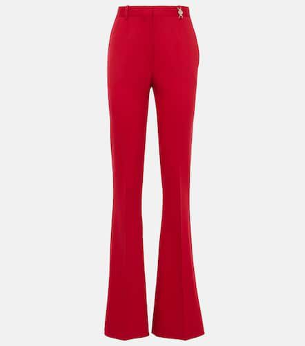 Pantalones flared de lana grain de poudre - Versace - Modalova