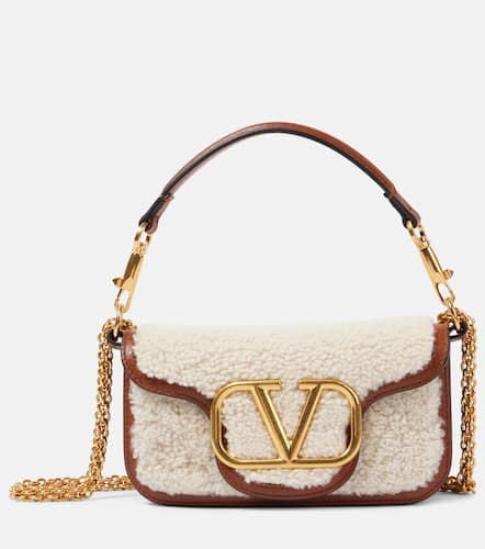 LocÃ² Small shearling and leather shoulder bag - Valentino Garavani - Modalova