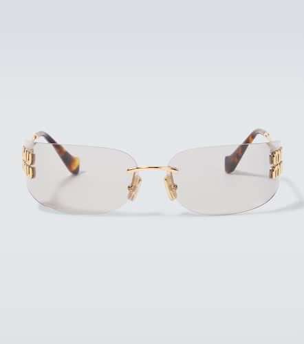 Miu Miu Logo oval sunglasses - Miu Miu - Modalova