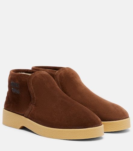 Stivaletti in suede con shearling - Miu Miu - Modalova