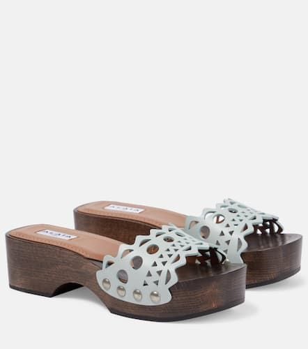 AlaÃ¯a Vienne leather and wood slides - Alaia - Modalova