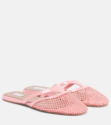 Patent leather-trimmed fishnet mules - Alaia - Modalova