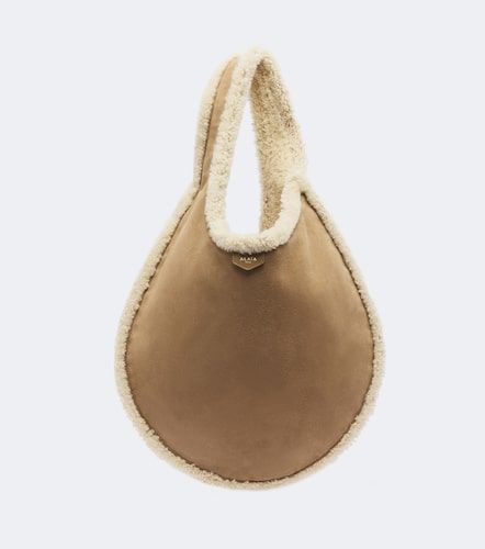 Alaïa Schultertasche One Piece mit Shearling - Alaia - Modalova