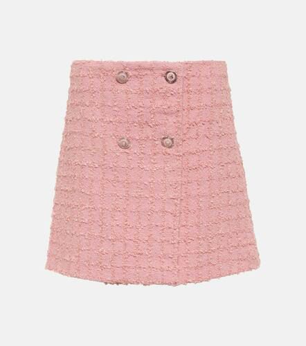 Minigonna in tweed di misto lana bouclé - Versace - Modalova