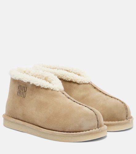 Shearling-lined suede ankle boots - Miu Miu - Modalova