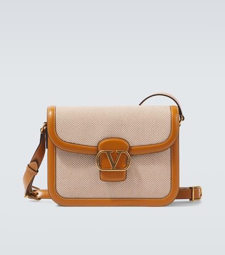 TO5 leather-trimmed canvas shoulder bag - Valentino Garavani - Modalova