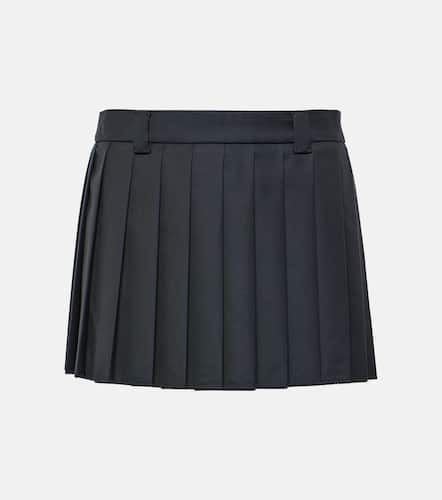 Pleated virgin wool miniskirt - Miu Miu - Modalova