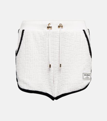 Monogram cotton-blend shorts - Balmain - Modalova