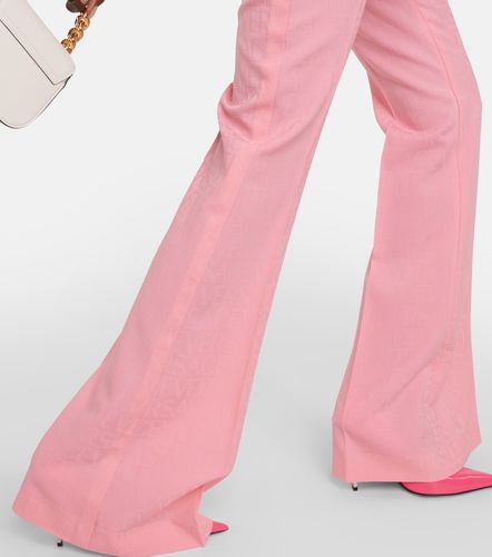 Pantaloni flared Allover in lana - Versace - Modalova
