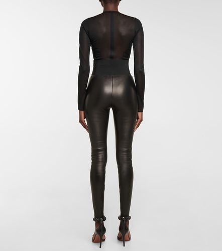 Belted high-rise leather leggings - Alaia - Modalova