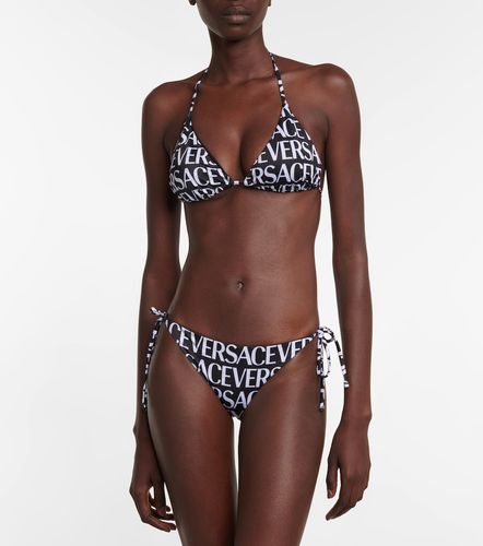 Versace Slip bikini con logo - Versace - Modalova