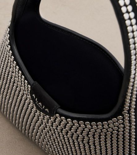 Mini studded suede top-handle bag - Alaia - Modalova
