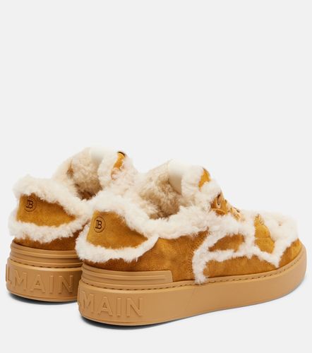 Shearling-trimmed suede sneakers - Balmain - Modalova