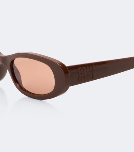 Miu Miu Signature oval sunglasses - Miu Miu - Modalova
