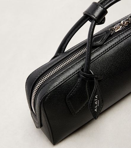 Le Teckel Small leather clutch - Alaia - Modalova