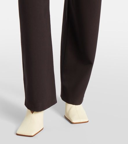 Alaïa Gerade Hose aus Wolle mit Leder - Alaia - Modalova