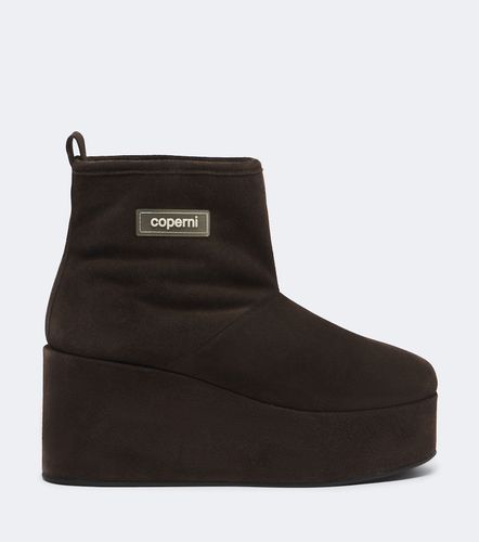 Stivaletti con zeppa in suede e shearling - Coperni - Modalova