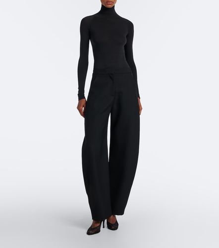 Alaia Wool barrel-leg pants - Alaia - Modalova