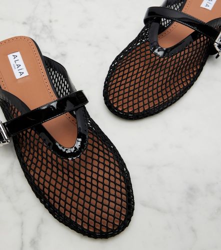 Alaia Fishnet leather-trimmed mules - Alaia - Modalova