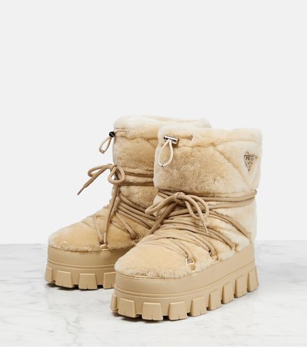 Shearling and leather snow boots - Prada - Modalova