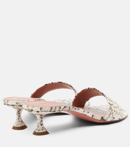 Andreea snake-print leather mules - Amina Muaddi - Modalova