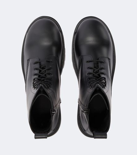 Combat Strike leather combat boots - Balenciaga - Modalova