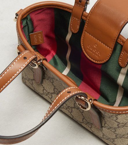 GG Canvas leather-trimmed top-handle bag - Gucci - Modalova