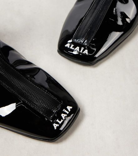 Sneaker faux patent leather ankle boots - Alaia - Modalova