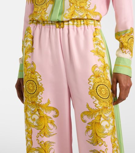 Printed silk twill wide-leg pants - Versace - Modalova