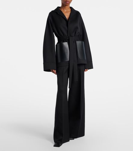 Leather-trimmed virgin wool wide-leg pants - Alaia - Modalova