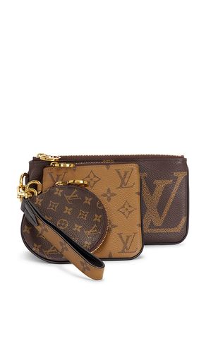 Louis Vuitton Reverse Monogram Giant Trio Pouch in - FWRD Renew - Modalova