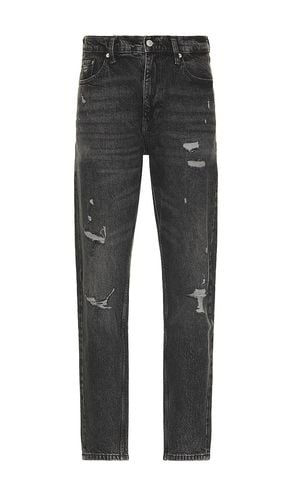 Isaac Relaxed Tapered Jeans in Black. - size 30 (also in 32, 34, 36) - Tommy Jeans - Modalova