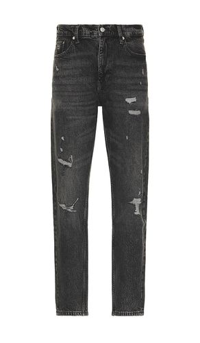 Isaac Relaxed Tapered Jeans in Black. - size 30 (also in 32, 36) - Tommy Jeans - Modalova