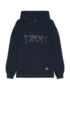 Relaxed Tommy Glitter Hoodie in Navy. - size L (also in M, S, XL/1X) - Tommy Jeans - Modalova