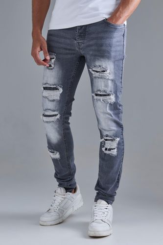 Skinny Stacked Distressed Ripped Jeans In - 32R - boohooMAN - Modalova