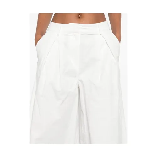 White Buttoned Pants with Pockets - The Garment - Modalova