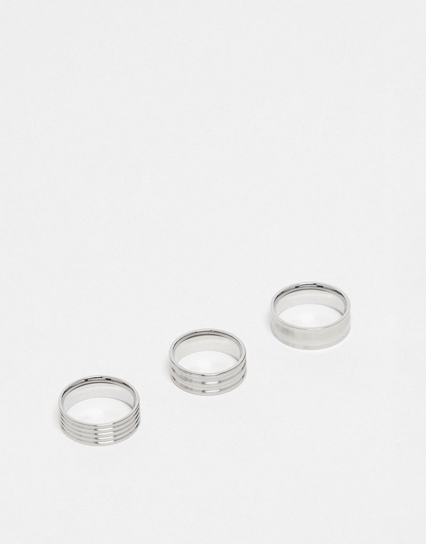 Confezione da 3 anelli a fascia in acciaio inossidabile argentato spazzolato con motivi in rilievo - ASOS DESIGN - Modalova