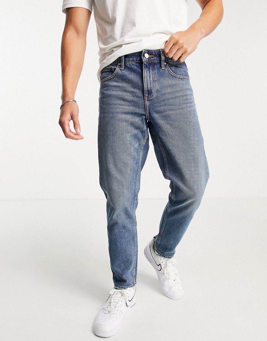 Jeans classici rigidi slavato effetto sporco vintage - ASOS DESIGN - Modalova