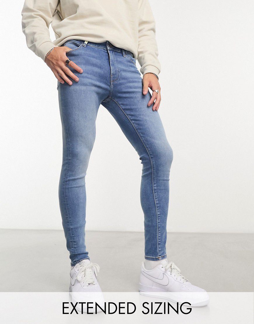 Jeans elasticizzati lavaggio medio - ASOS DESIGN - Modalova