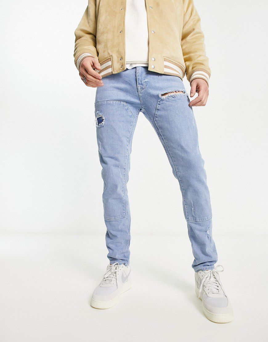 Jeans skinny azzurro slavato con pannelli cut and sew - ASOS DESIGN - Modalova