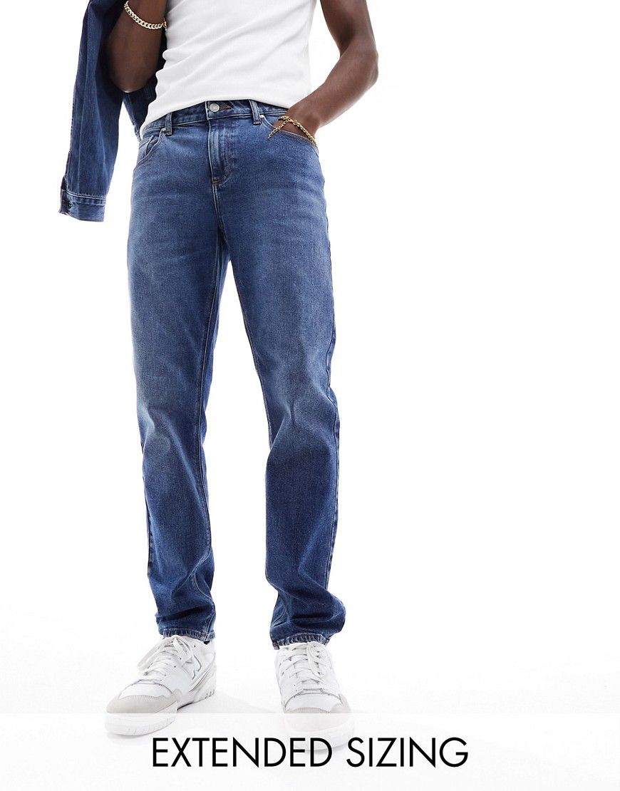 Jeans stretch slim lavaggio scuro - ASOS DESIGN - Modalova