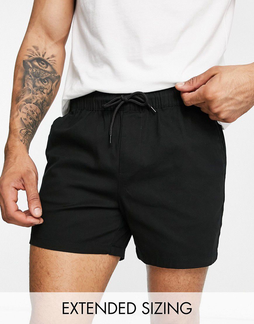Pantaloncini chino slim taglio corto neri con vita elasticizzata - ASOS DESIGN - Modalova
