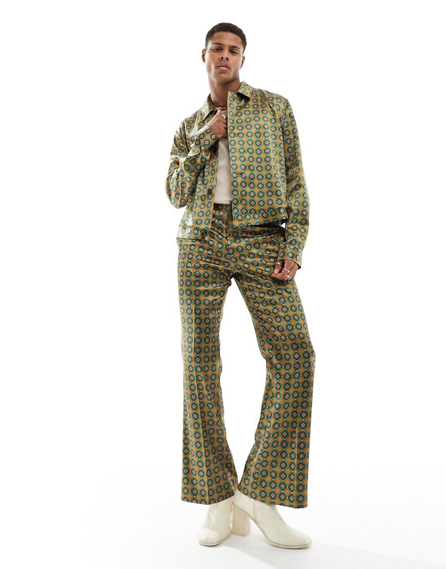 Pantaloni a zampa eleganti con stampa multicolore geometrica in coordinato - ASOS DESIGN - Modalova